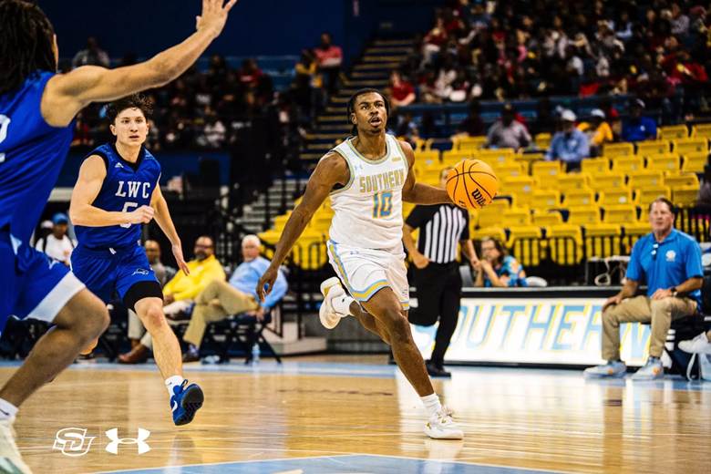 A basketball player dribbling a basketball
AI-generated content may be incorrect.